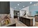 Large kitchen with island, ample counter space, and stainless steel appliances at 9249 Ivywood St, Clermont, FL 34711