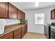 Bright laundry room with ample cabinet space and washer/dryer at 9249 Ivywood St, Clermont, FL 34711