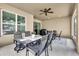 Screened porch with seating area and ceiling fan at 9249 Ivywood St, Clermont, FL 34711