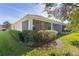 Screened patio with ceiling fan, offering outdoor living space at 1018 Green Gate Blvd, Groveland, FL 34736
