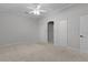 Bright bedroom featuring carpet, double closets and ceiling fan at 1018 Green Gate Blvd, Groveland, FL 34736