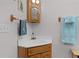 Small bathroom with corner vanity and wood cabinet at 1600 Se 52Nd St, Ocala, FL 34480