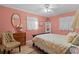 Serene bedroom with floral bedding and vintage dresser at 1600 Se 52Nd St, Ocala, FL 34480