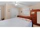Bedroom with double bed, wooden dresser, and ceiling fan at 1600 Se 52Nd St, Ocala, FL 34480