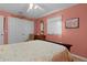 Relaxing bedroom with double doors and a comfy bed at 1600 Se 52Nd St, Ocala, FL 34480