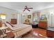 Bedroom with wooden dresser and ceiling fan at 1600 Se 52Nd St, Ocala, FL 34480