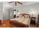 Bedroom with wooden bed frame and ceiling fan at 1600 Se 52Nd St, Ocala, FL 34480