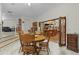Charming dining room with wood table and view into kitchen at 1600 Se 52Nd St, Ocala, FL 34480