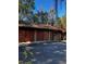 Three-car garage with red and brown doors at 1600 Se 52Nd St, Ocala, FL 34480