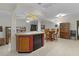 Kitchen features an island with seating and breakfast bar at 1600 Se 52Nd St, Ocala, FL 34480