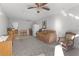 Spacious living room featuring a sofa, rocking chair and kitchenette at 1600 Se 52Nd St, Ocala, FL 34480