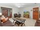 Living room with leather sofas and a wooden cabinet at 1600 Se 52Nd St, Ocala, FL 34480