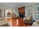 Living room with hardwood floors, fireplace, and two armchairs at 1600 Se 52Nd St, Ocala, FL 34480
