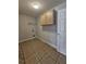 Laundry room with tile floor, upper cabinets and shelving at 1761 12Th St, Orange City, FL 32763