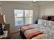 Guest bedroom with wood flooring and large window at 1824 Seyler St, The Villages, FL 34762