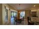 Charming breakfast nook with a stained glass light fixture and access to the backyard at 1881 Sassparilla Way, The Villages, FL 32162