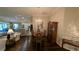 Elegant dining room features hardwood floors, a chandelier and views to the kitchen at 1881 Sassparilla Way, The Villages, FL 32162