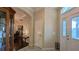 Bright entryway with hardwood floors, a charming stained-glass door, and views to dining room at 1881 Sassparilla Way, The Villages, FL 32162