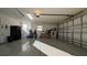 Spacious garage with ample storage and room for multiple vehicles at 1881 Sassparilla Way, The Villages, FL 32162