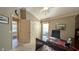 Sunlit home office with a large desk and built-ins at 1881 Sassparilla Way, The Villages, FL 32162