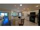 Modern kitchen with white cabinets, granite countertops, and black appliances at 1881 Sassparilla Way, The Villages, FL 32162