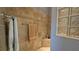 Large walk-in shower with tiled walls and seat at 1881 Sassparilla Way, The Villages, FL 32162