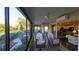 Relaxing sunroom offering views of the backyard and kitchen at 1881 Sassparilla Way, The Villages, FL 32162