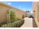 Landscaped backyard with arbor and stone path at 2169 Smoaks St, The Villages, FL 32162