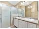 Double vanity bathroom with a large shower and updated fixtures at 2169 Smoaks St, The Villages, FL 32162