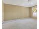 Bright and airy bedroom with a ceiling fan and neutral walls at 2169 Smoaks St, The Villages, FL 32162