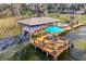 Aerial view of dock with boat lift and seating area at 3219 Landing Vw, Tavares, FL 32778