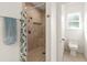 Bathroom with shower and toilet, featuring tile flooring at 3219 Landing Vw, Tavares, FL 32778