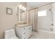 Clean bathroom with a white vanity, granite countertop, and bathtub at 3219 Landing Vw, Tavares, FL 32778