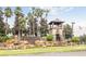 Gated entrance to community with waterfall feature at 3219 Landing Vw, Tavares, FL 32778