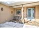 Quaint front porch with tile flooring and seating area at 3219 Landing Vw, Tavares, FL 32778