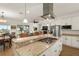 Modern kitchen with granite island and stainless steel appliances at 3219 Landing Vw, Tavares, FL 32778