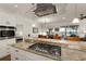 Modern kitchen with granite countertops, stainless steel appliances, and an island at 3219 Landing Vw, Tavares, FL 32778