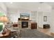 Cozy living room with fireplace and built-in shelving at 3219 Landing Vw, Tavares, FL 32778