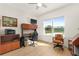 Home office with built-in desk and cabinets, plus a view of the backyard at 3219 Landing Vw, Tavares, FL 32778