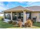 Spacious screened-in porch with outdoor grill at 3219 Landing Vw, Tavares, FL 32778