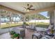 Relaxing screened porch overlooking a lake and backyard at 3219 Landing Vw, Tavares, FL 32778