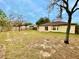 Large backyard with a patio and fenced area at 61 Fir Dr, Ocala, FL 34472