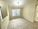 Bright dining room with tile floors and chandelier at 61 Fir Dr, Ocala, FL 34472
