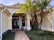 Inviting home exterior featuring a walkway, lush landscaping, and a charming entrance at 752 Maybank Loop, The Villages, FL 32162