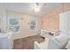 Adorable Bedroom with a crib, changing table and plenty of natural light at 4904 Sw 45Th St, Ocala, FL 34474