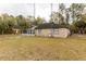 Brick house with screened porch and detached shed at 12359 Ne Highway 314, Silver Springs, FL 34488