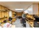 Unfinished basement workshop with ample storage and workbench at 12359 Ne Highway 314, Silver Springs, FL 34488