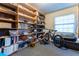 Home office with ample shelving and space for a bicycle at 12359 Ne Highway 314, Silver Springs, FL 34488