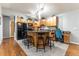 Modern kitchen with wood cabinets, granite countertops and black appliances at 12359 Ne Highway 314, Silver Springs, FL 34488