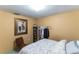 Bedroom with a bed, clothing rack, and chair at 12359 Ne Highway 314, Silver Springs, FL 34488